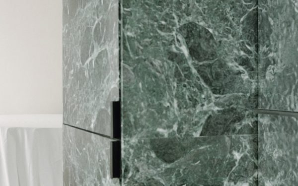 Monolithic inexperienced marble carves condo inside in Milan by AIM Studio