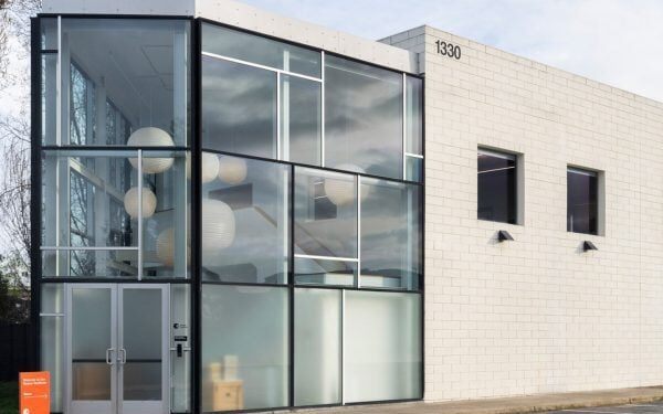 Eames Institute renovates 90s industrial constructing to deal with headquarters